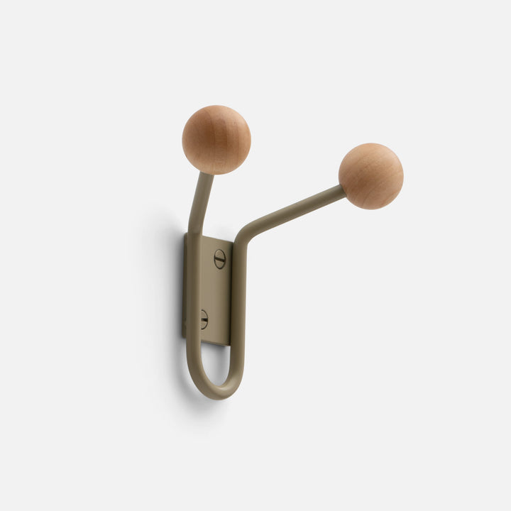 Angled view of Mollie Double Hook in Lichen Satin showing two oak ball ends and painted steel body on white background