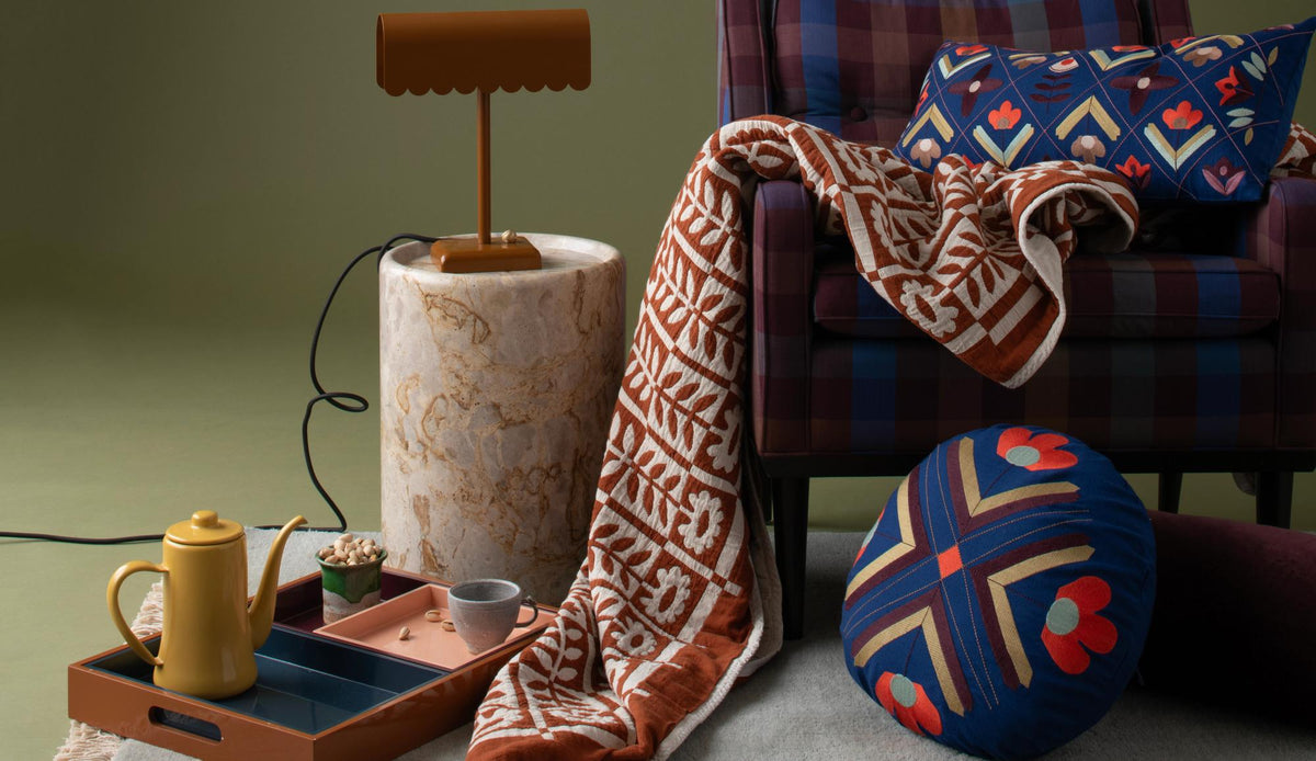 Chair with blanket strewn across it.