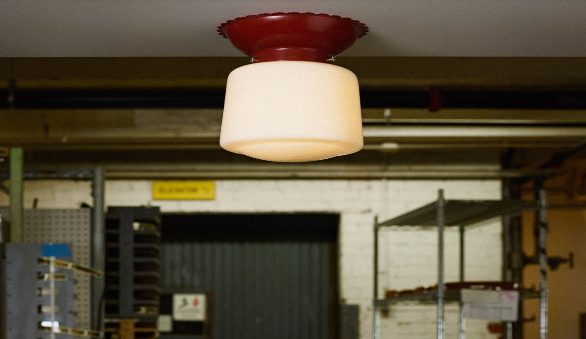 Paprika colored flush mount with scalloped edges and drum shade