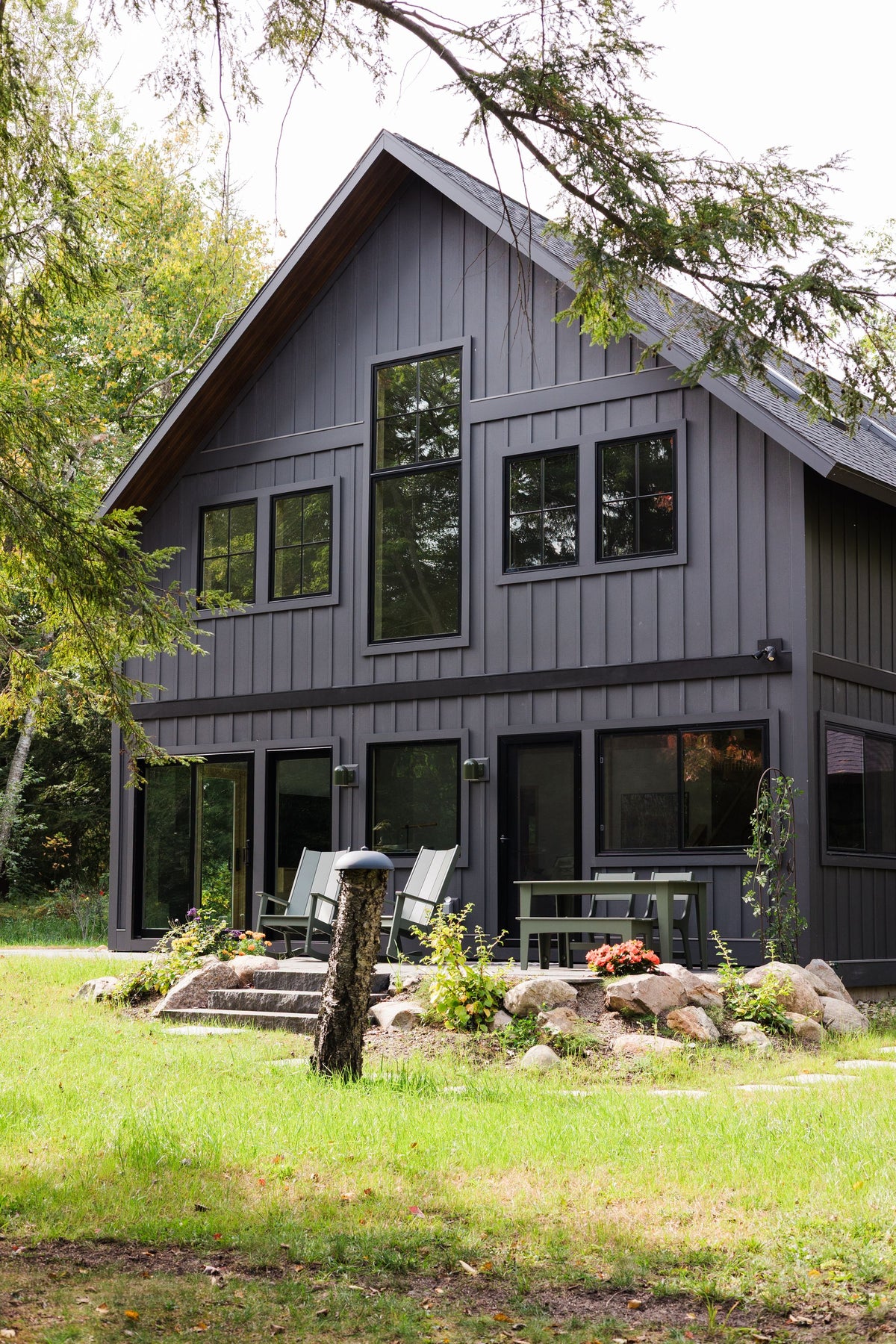 House painted black in woods