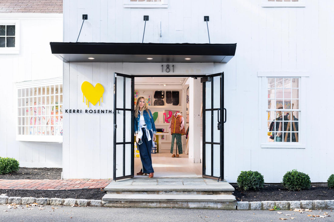 Woman standing in front of her store.