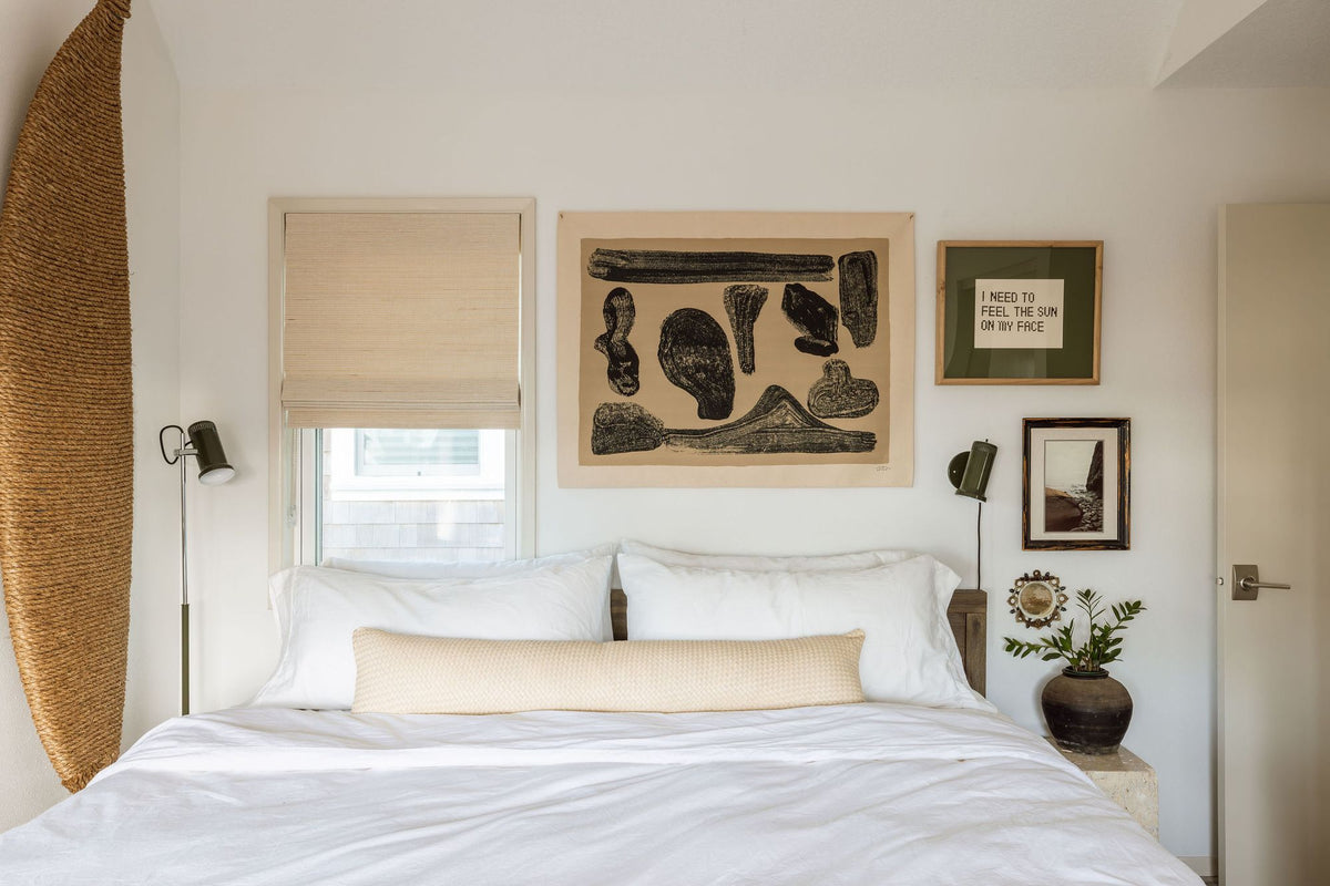 Sconces above bed.