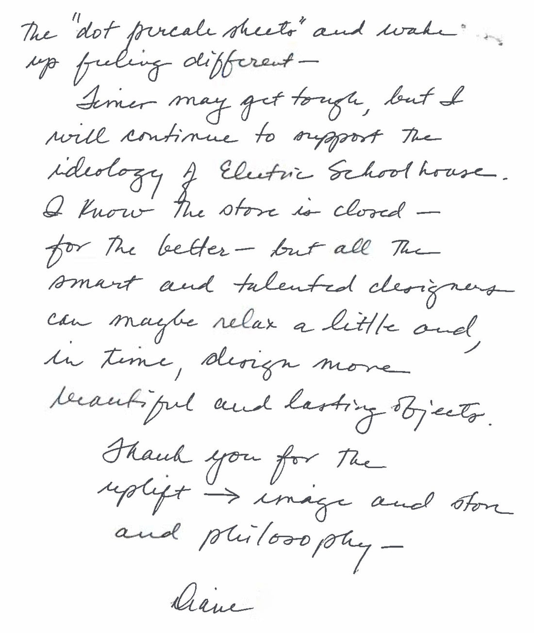 Close-up of a handwritten letter page in black cursive ink on white paper, a personal note with a visible signature at the bottom