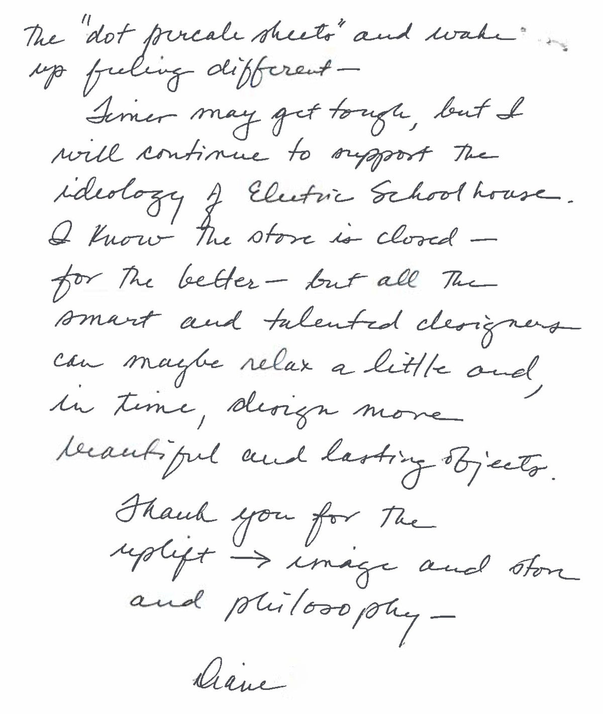 Close-up of a handwritten letter page in black cursive ink on white paper, a personal note with a visible signature at the bottom
