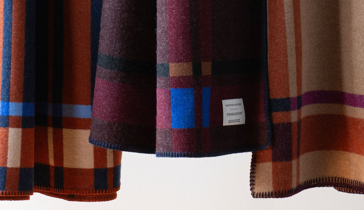 Plaid blanket on a sofa.