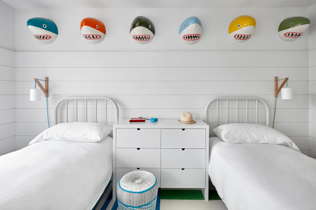 Kids room with two beds and shark busts