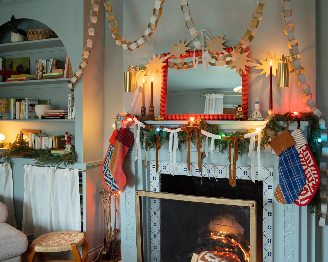 Cozy mantle full of garland.