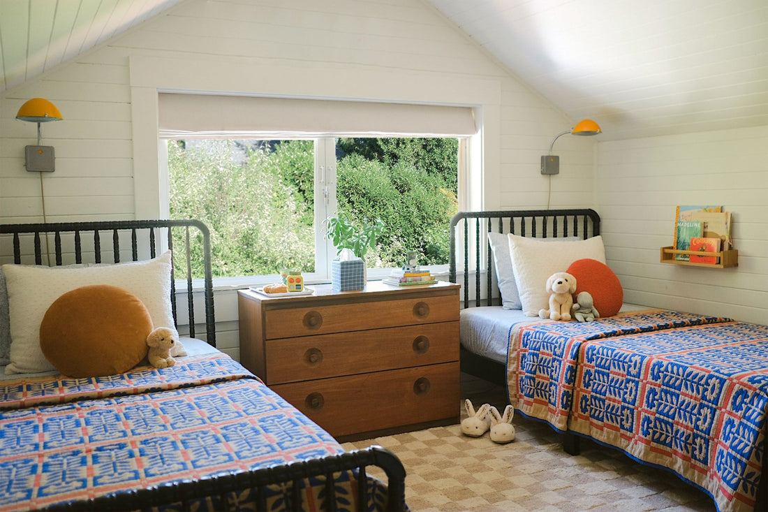 Quilt on bed.
