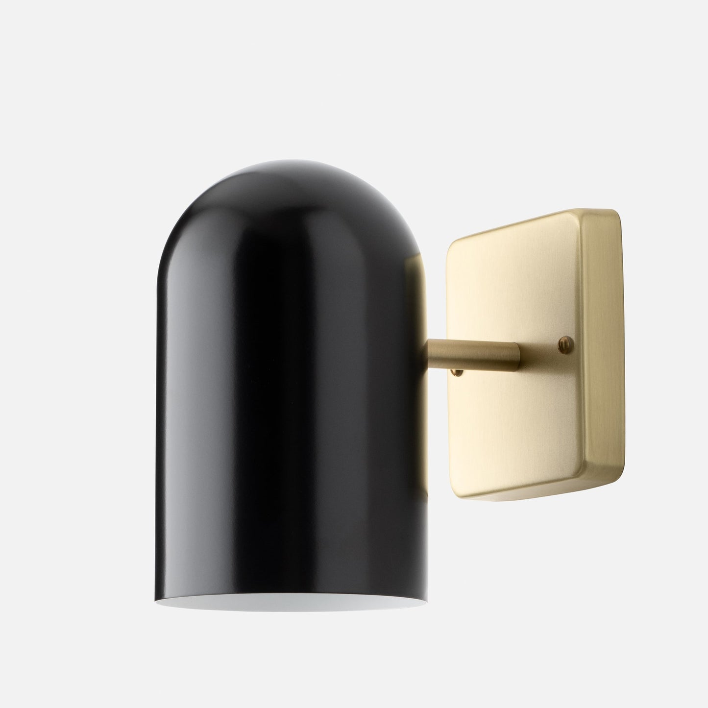 Close-up of Allegheny 4.5 inch indoor/outdoor sconce showcasing black cylindrical shade and brass backplate on white background