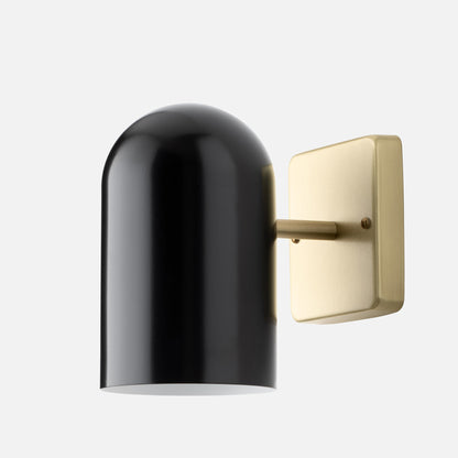 Close-up of Allegheny 4.5 inch indoor/outdoor sconce showcasing black cylindrical shade and brass backplate on white background