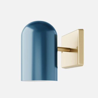 Close up side view of Allegheny 4.5 inch indoor and outdoor sconce showing blue rounded metal shade and brass square wall plate on white background