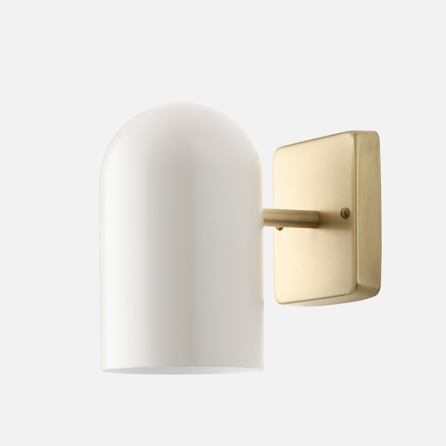 Close-up of Allegheny 4.5 inch indoor/outdoor sconce showing white cylindrical glass shade and brushed brass backplate on white background