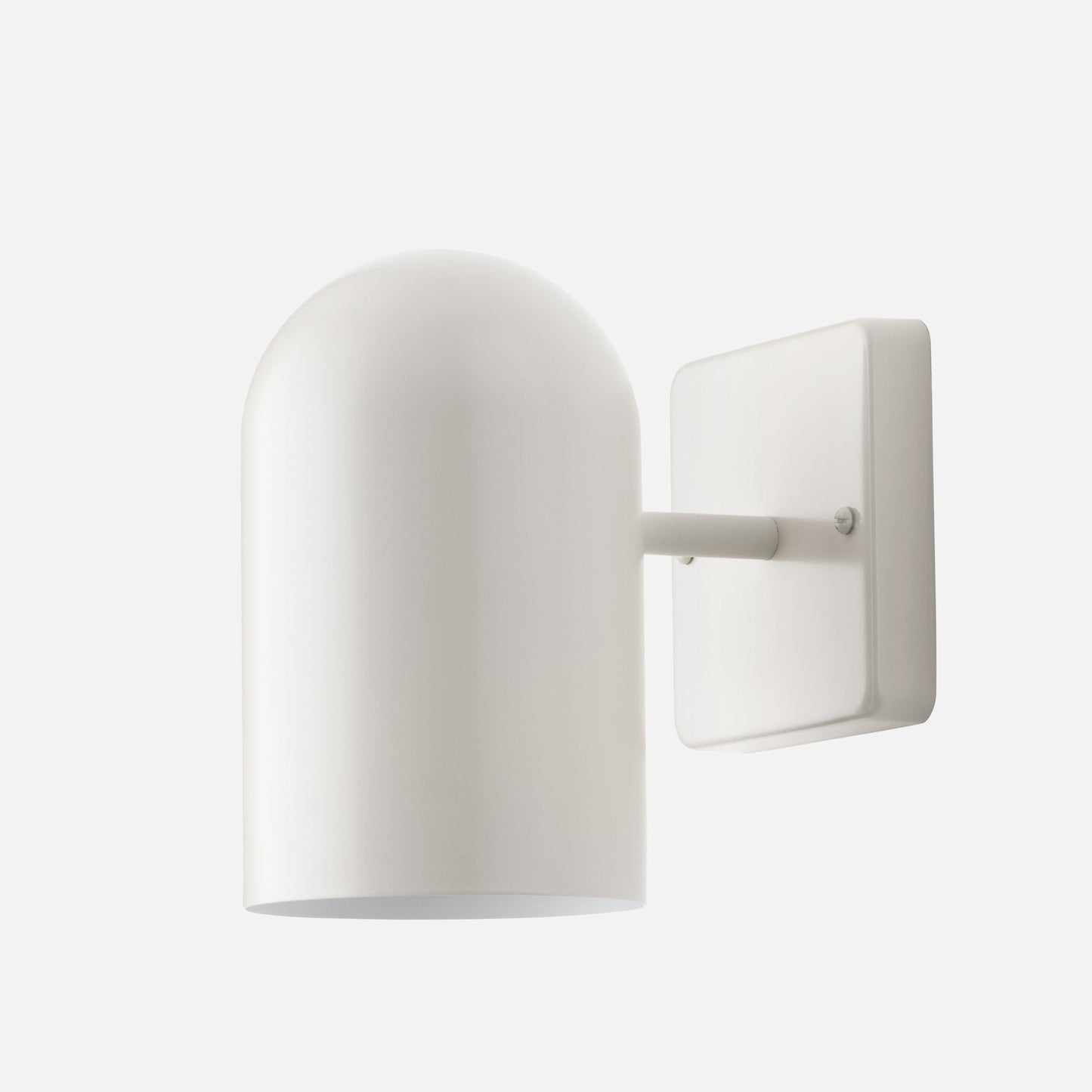 Close-up three-quarter view of Allegheny 4.5-inch indoor/outdoor sconce showcasing cylindrical shade, short arm, and rectangular wall plate on white background