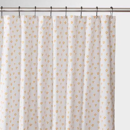 Front view of Thistle shower curtain showcasing honey-yellow thistle pattern on white background with metal shower rod