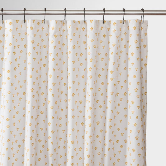 Front view of Thistle shower curtain showcasing honey-yellow thistle pattern on white background with metal shower rod