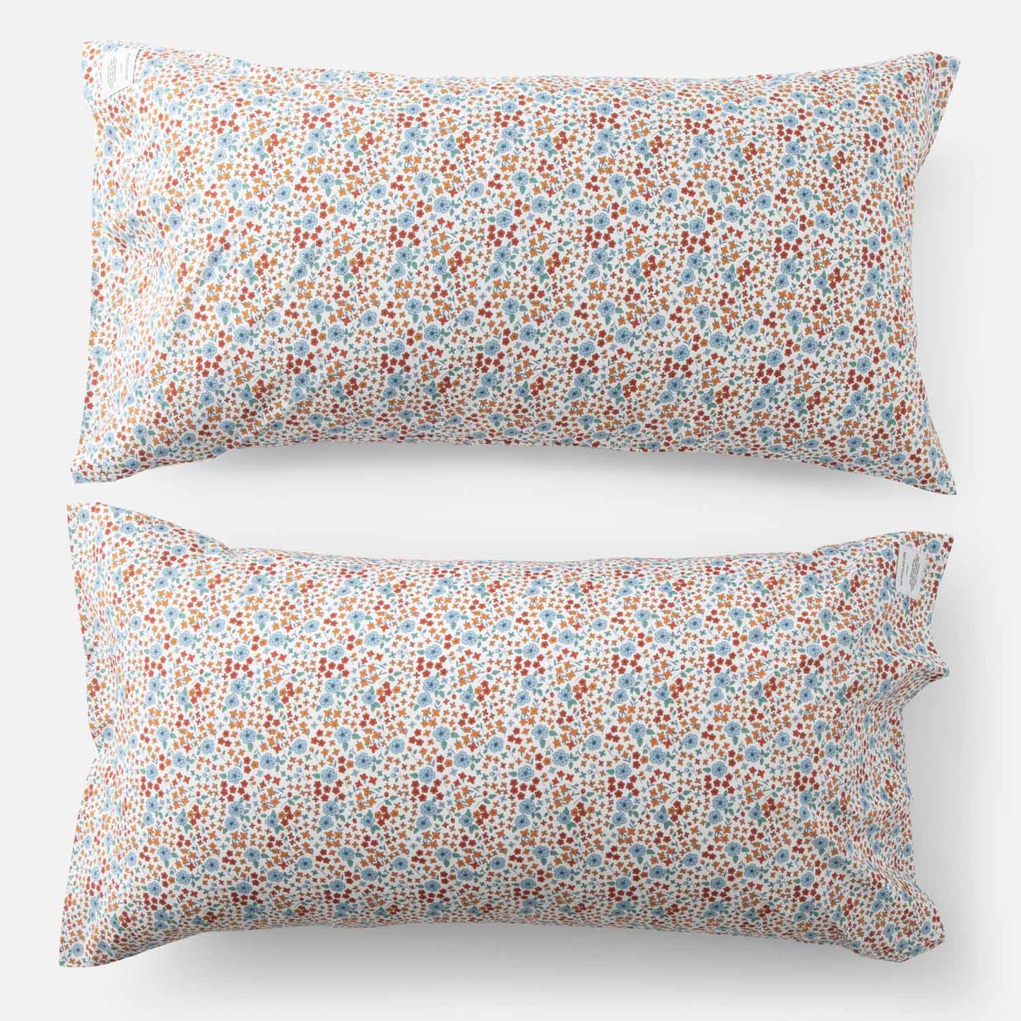 Top-down view of Wallowa Floral Percale pillow case set of 2 showcasing small chamomile floral print on white background