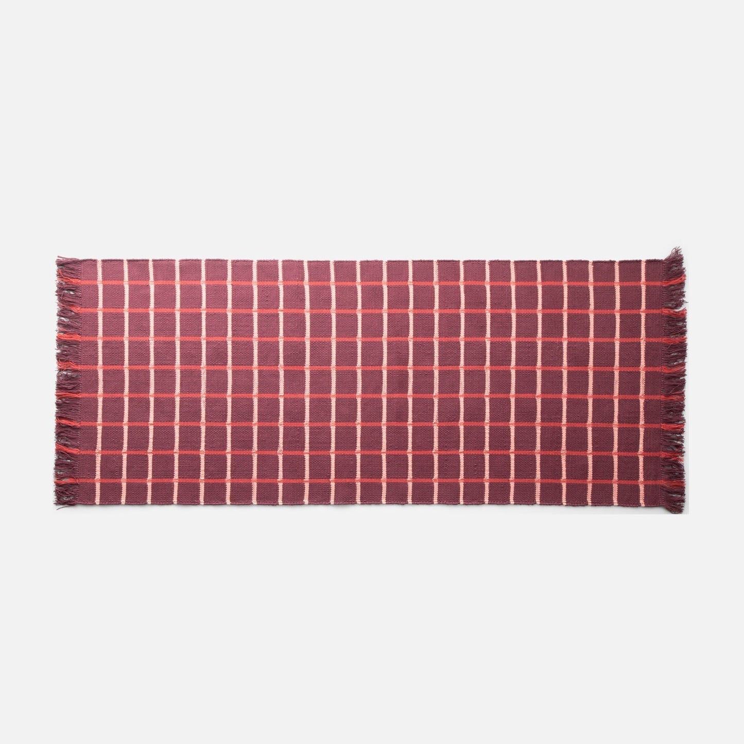 Top view of Cotton Grid Flatweave Rug in red showing grid pattern and fringed ends on white background