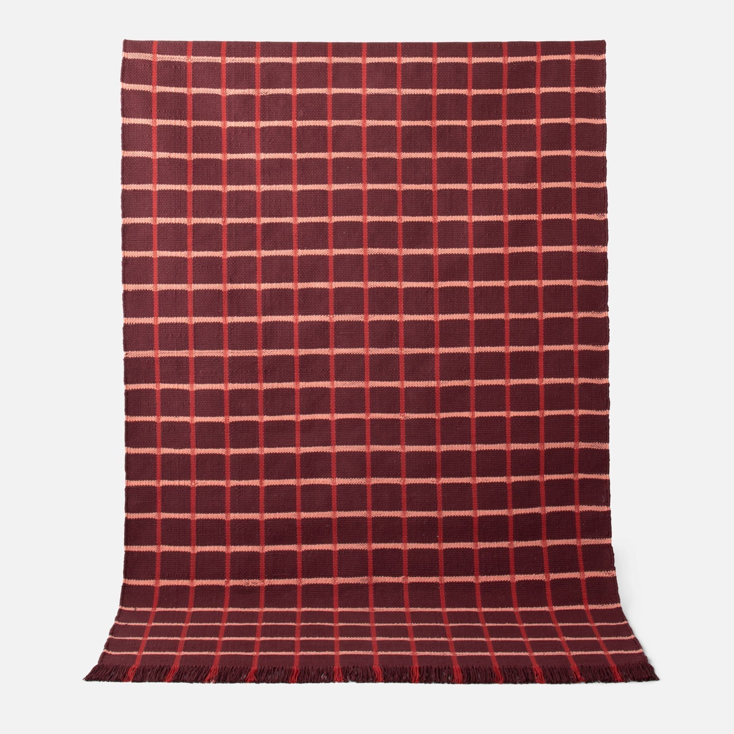 Full-length of Cotton Grid Flatweave Rug showing large contrasting grid pattern, flatwoven 100% cotton with fringed ends on white background
