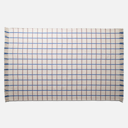 Top-down view of Cotton Grid Flatweave Rug showcasing large grid pattern and fringed short edges on white background