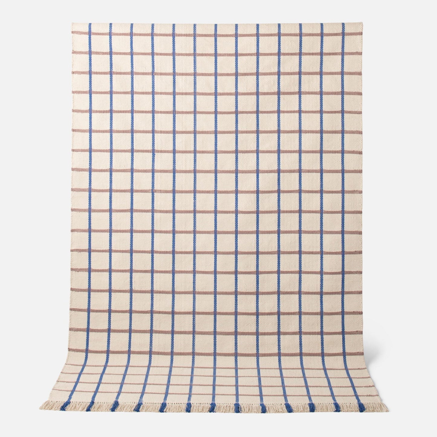 Top view of Cotton Grid Flatweave Rug showing blue and tan grid pattern on a cream background with fringe