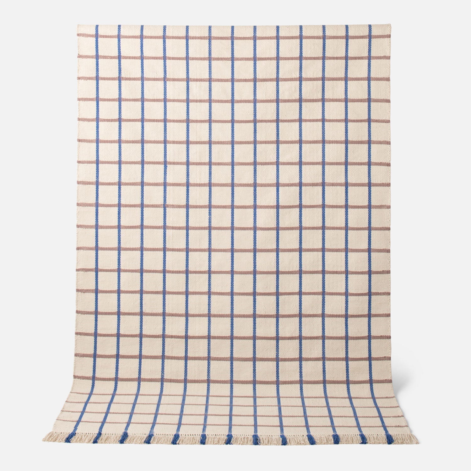 Top view of Cotton Grid Flatweave Rug showing blue and tan grid pattern on a cream background with fringe