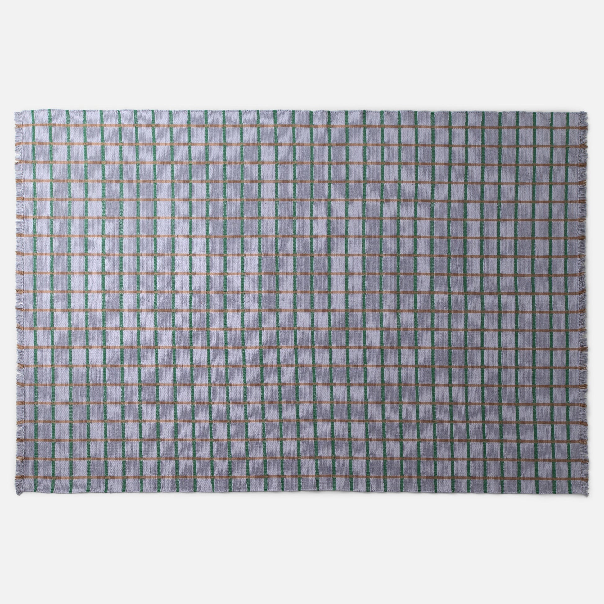 Top view of Cotton Grid Flatweave Rug with green and tan grid lines on pale lavender field and fringed edges