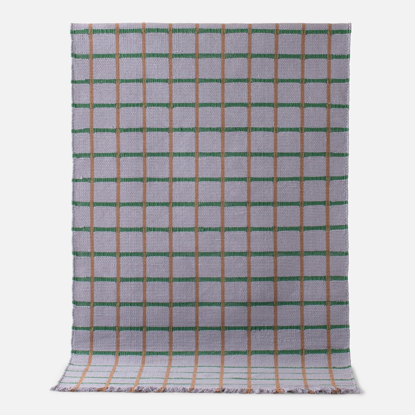 Flatlay of Cotton Grid Flatweave Rug showing grid pattern with green and tan lines on woven cotton background