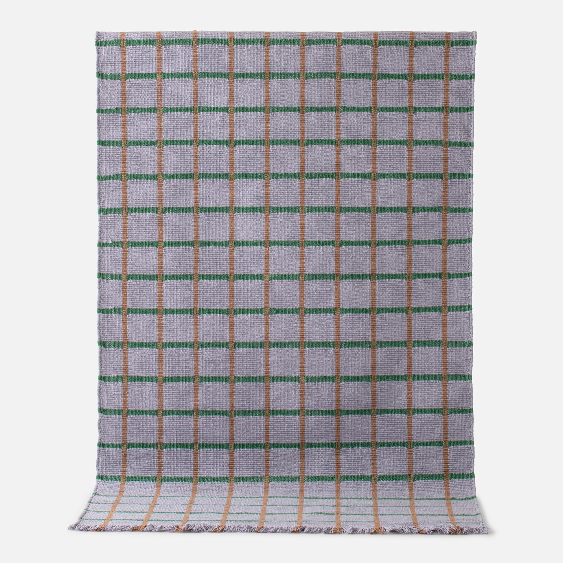 Flatlay of Cotton Grid Flatweave Rug showing grid pattern with green and tan lines on woven cotton background