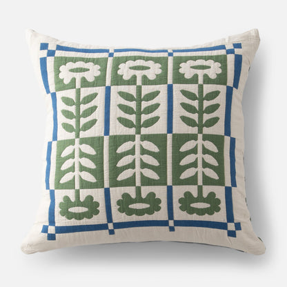 Front view of Stillwater Floral Sham showcasing green mirrored floral applique and blue grid on cream background