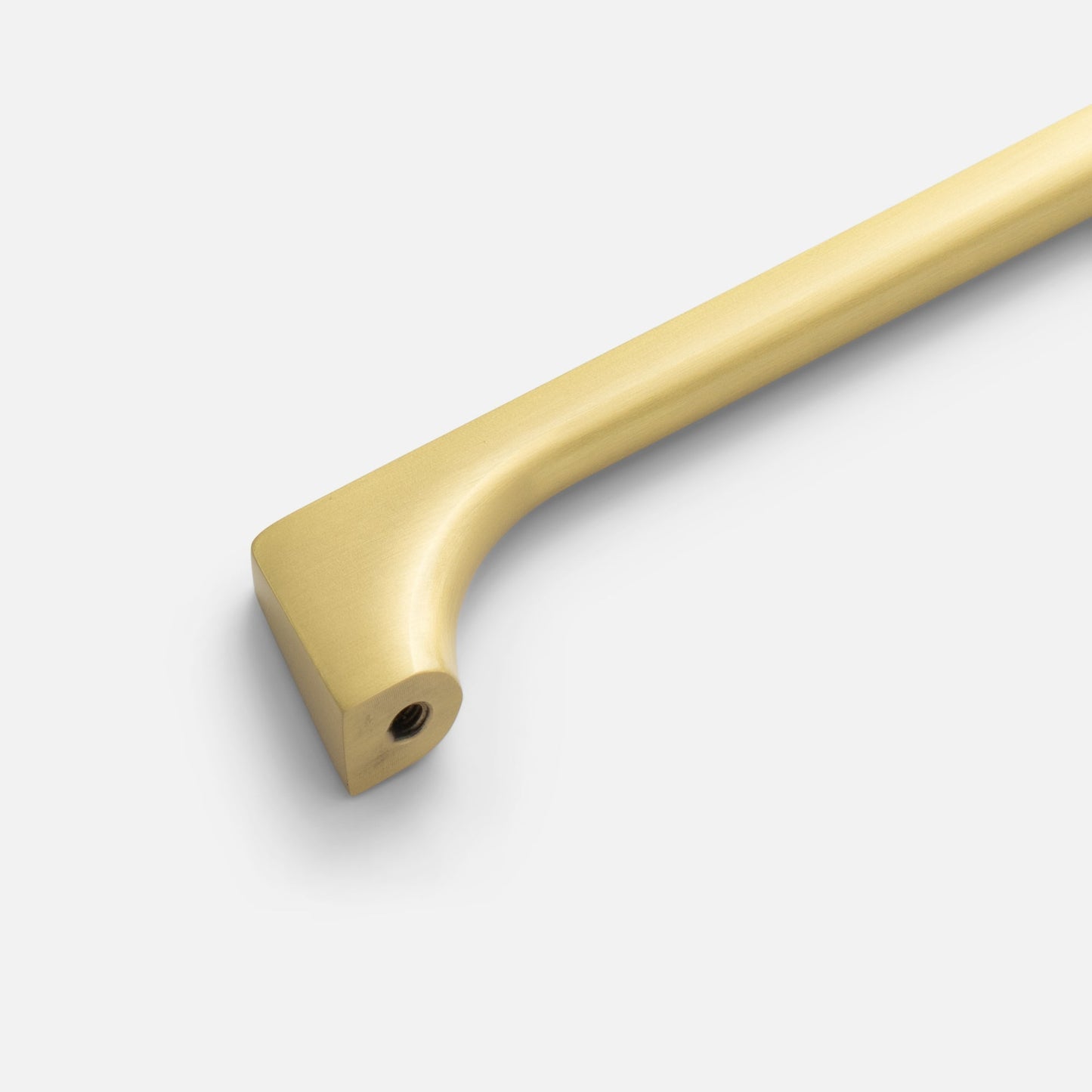Close-up of Truss Pull showing rounded profile, refined exterior angles, and Natural Brass finish on white background