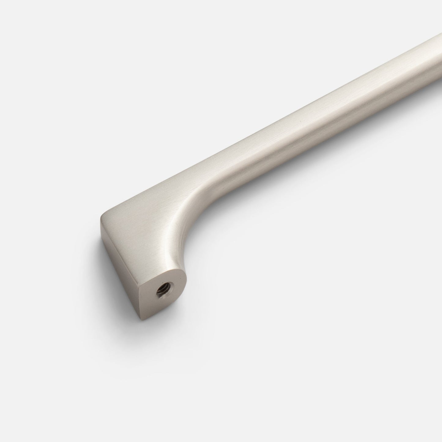 Close-up of Truss Pull cabinet pull showing brushed satin finish and refined exterior angles on a light background