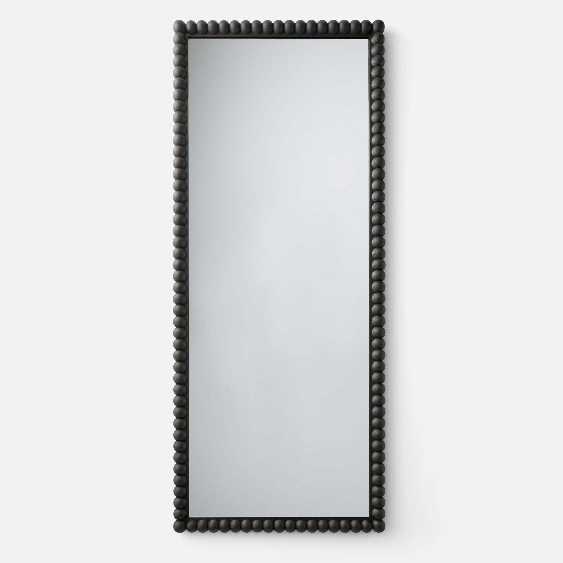 Front view of Bobbin mirror showcasing black beaded wood frame with white studio background