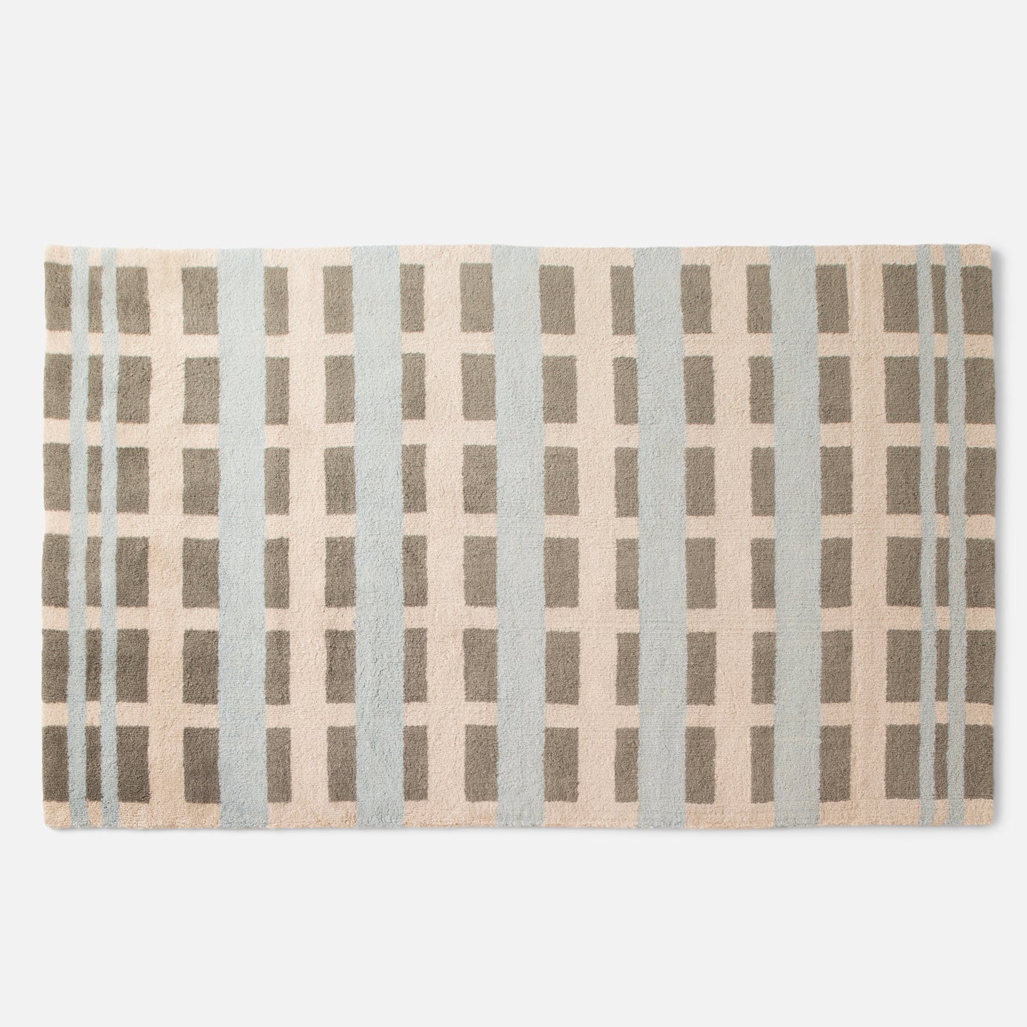 Cropped top view of Network Tufted Wool Rug showing geometric grid in beige, blue, and taupe with high-pile wool texture