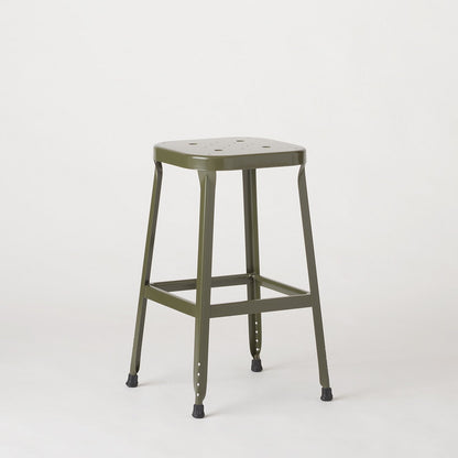 Three-quarter view of Schoolhouse Utility Stool 26-inch showing stamped seat, welded steel frame, and rubber feet on light background