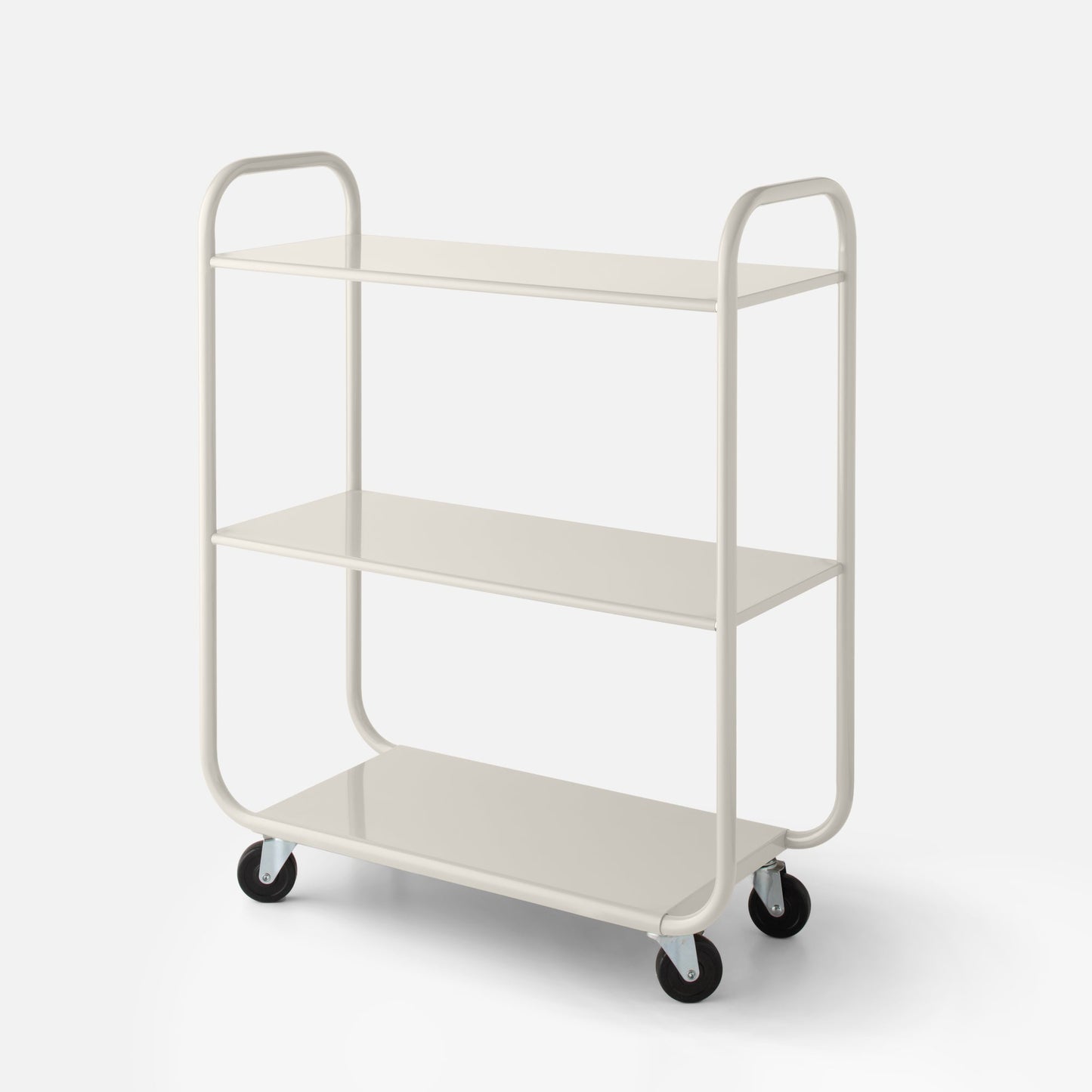 Front three-quarter view of Miller Storage Cart showcasing three shelves, rounded tubular frame, and caster wheels on a pale background