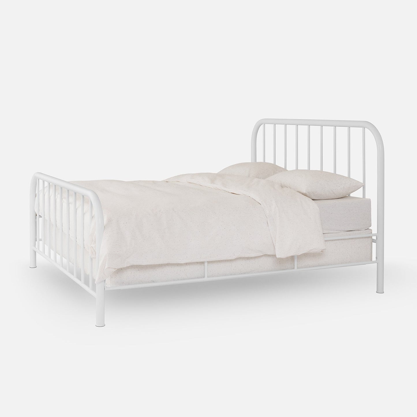 Three-quarter view of Hamilton Bed showing rounded metal headboard and footboard with vertical spindles on plain white background