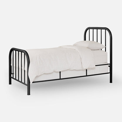 Three-quarter view of Hamilton Bed in black metal, showing rounded headboard and footboard with vertical slats and white bedding on light background