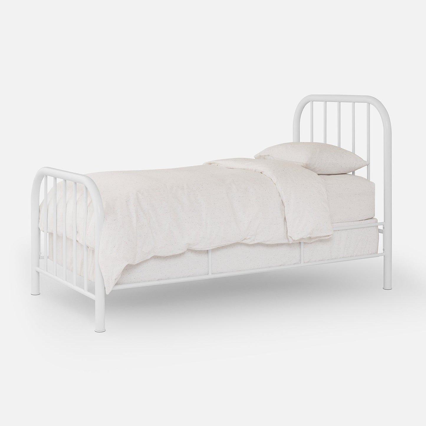 Three-quarter view of Hamilton Bed with white metal arched headboard and footboard, light speckled bedding, white background