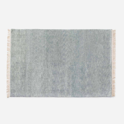 Top-down view of Mesa Wool Rug showcasing hand-loomed 100 percent New Zealand wool pile and fringe on a white background