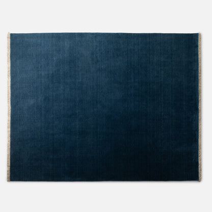 Top-down view of Mesa Wool Rug showing hand-loomed 100 percent New Zealand wool pile and natural fringe on white background