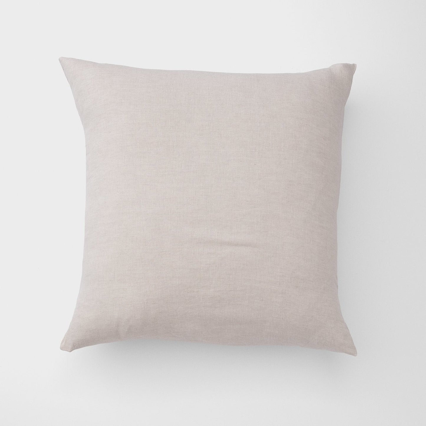 Front view of Linen Pillow Sham showcasing natural linen texture and square shape on a plain light-gray background