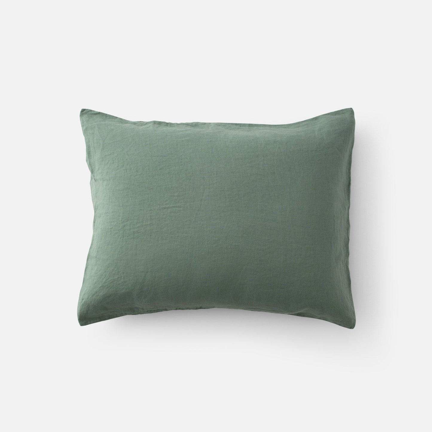 Top-down view of Linen Pillow Sham showcasing natural linen texture in laurel green on a white background
