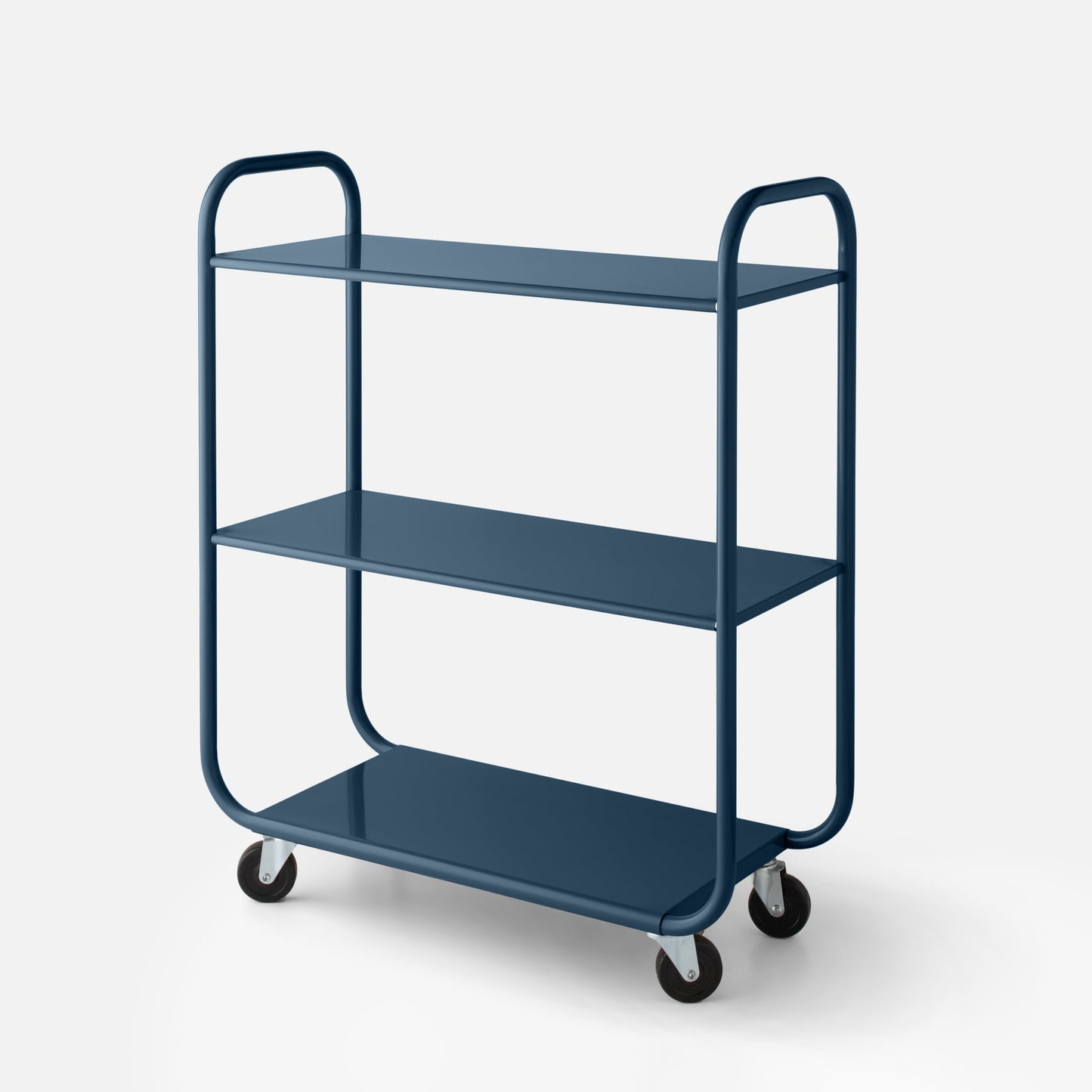 Three-quarter close-up of Miller storage cart showing three shelves, rounded tubular frame and casters on a white background