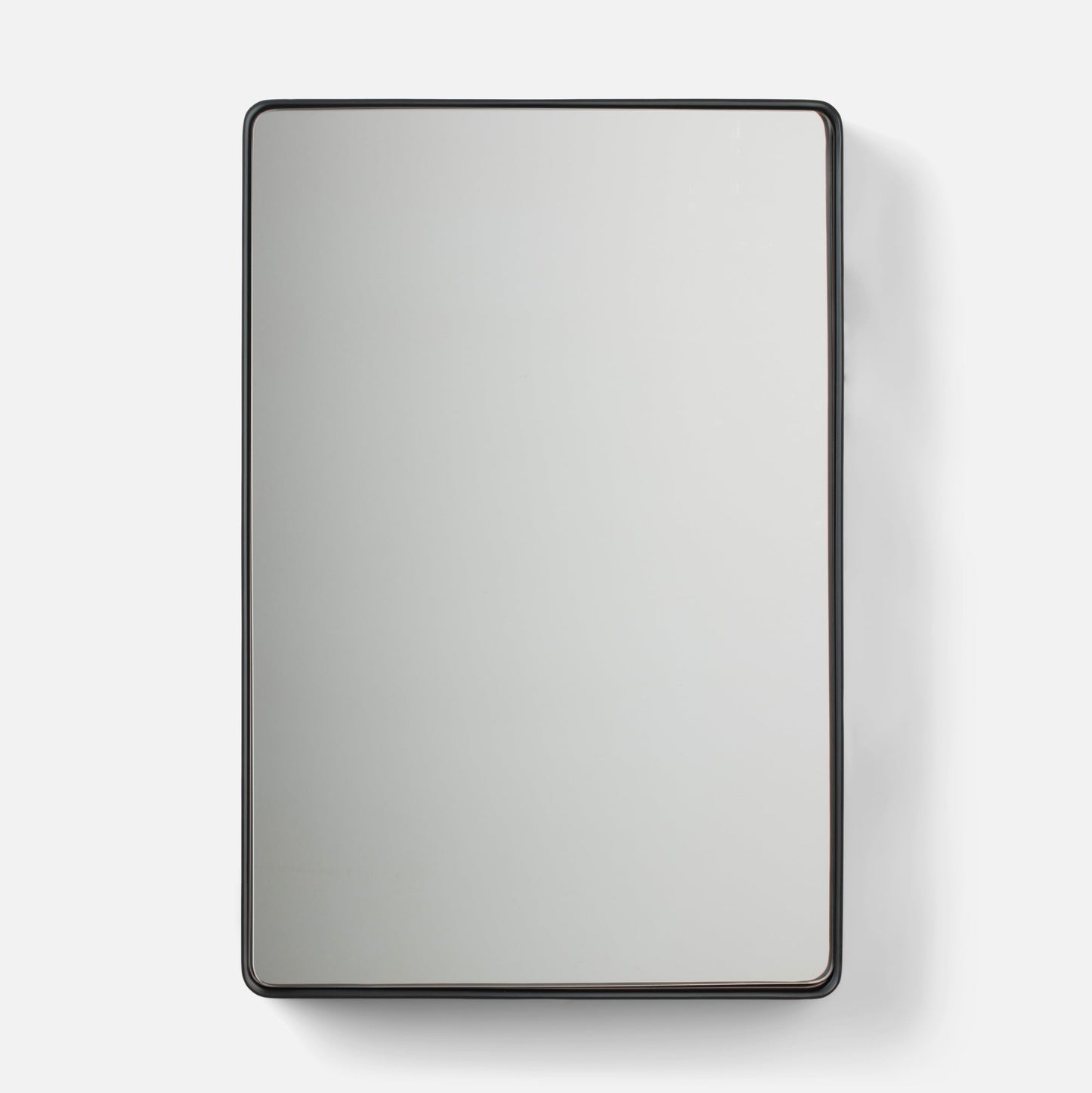 Close-up of Leo Mirror showcasing its thin rounded metal frame and rounded corners on a white background