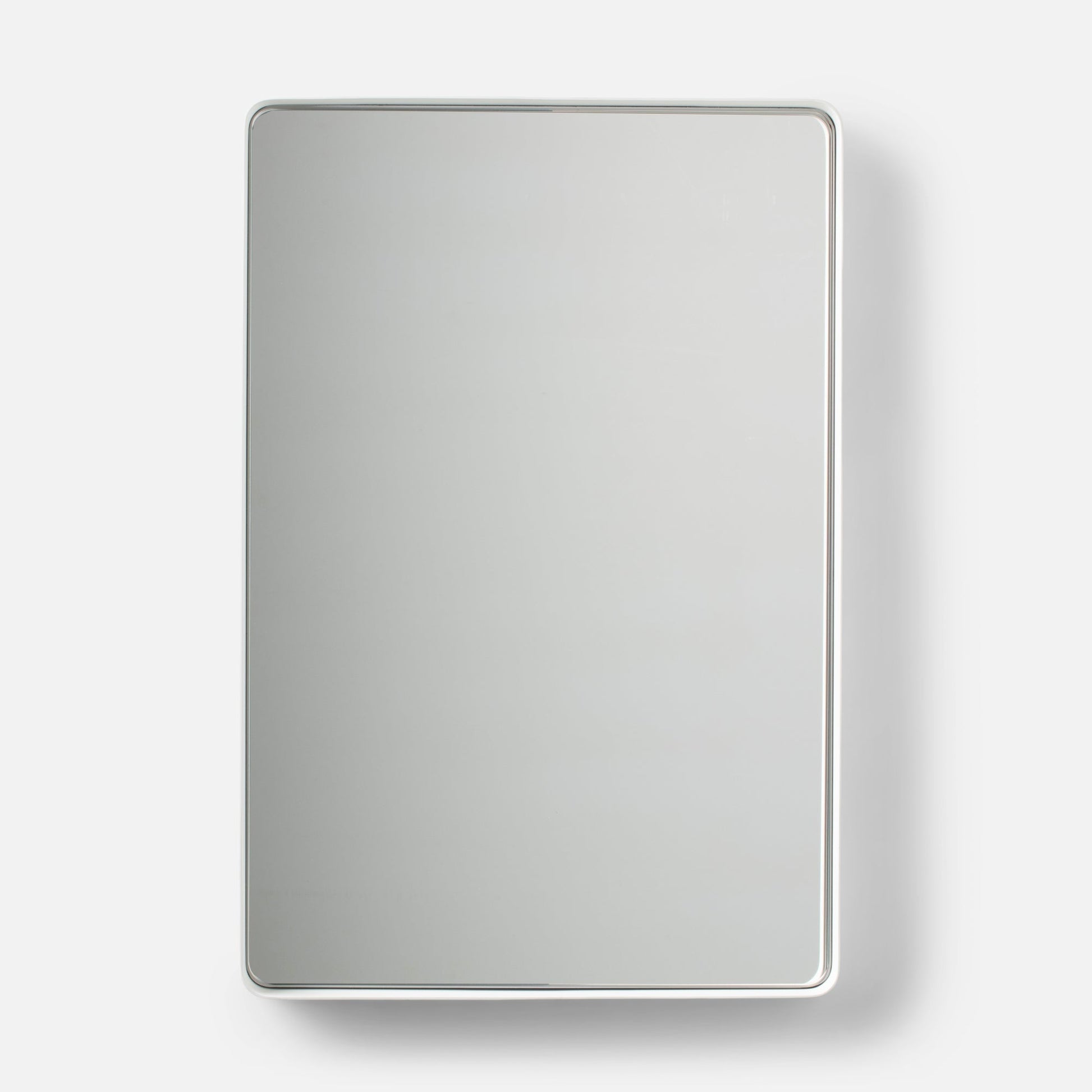 Front view of Leo mirror showcasing thin white metal frame with rounded corners on a white background