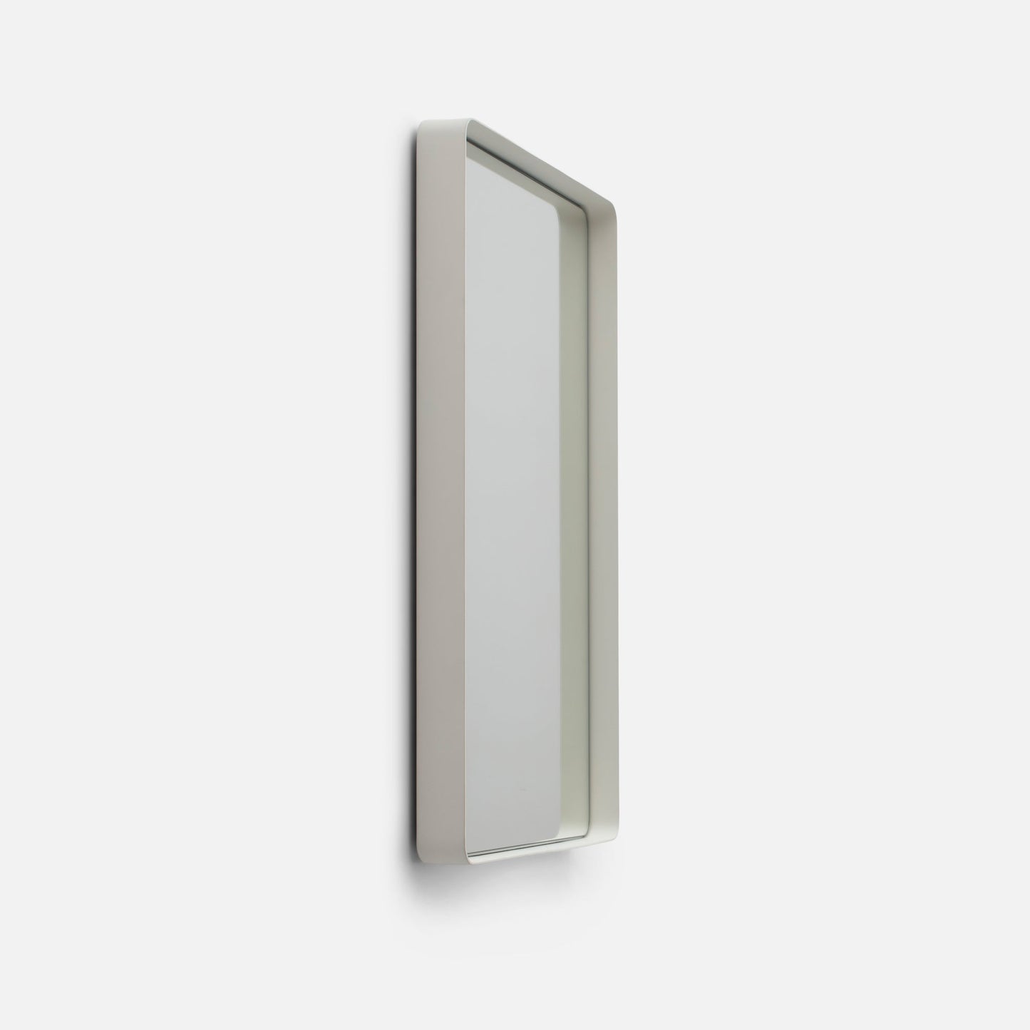 Angled close-up of Leo Mirror (20 by 30 inch) showing rounded white steel frame and 2 inch depth on white background