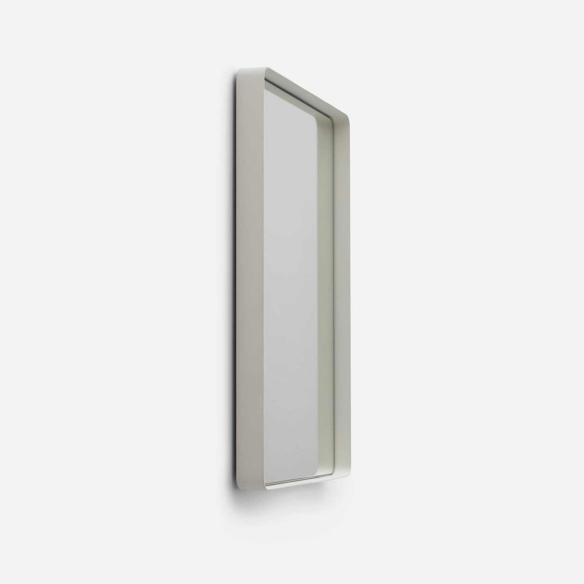 Angled close-up of Leo Mirror (20 by 30 inch) showing rounded white steel frame and 2 inch depth on white background
