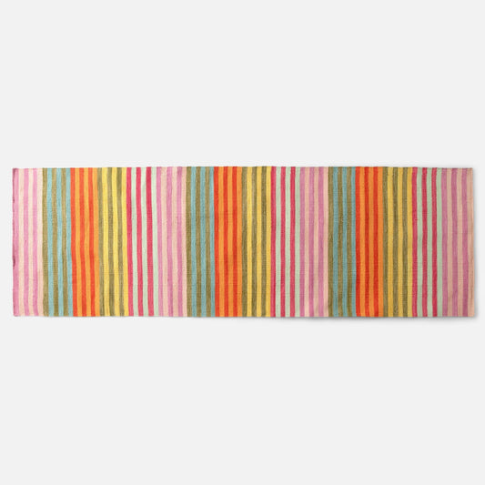 Top-down view of Lisse Performance flatweave rug showcasing bold multicolored vertical stripes on a white background