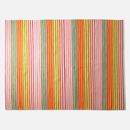 Overhead view of Lisse Performance Rug runner with bold multicolor stripes and flatweave texture on white