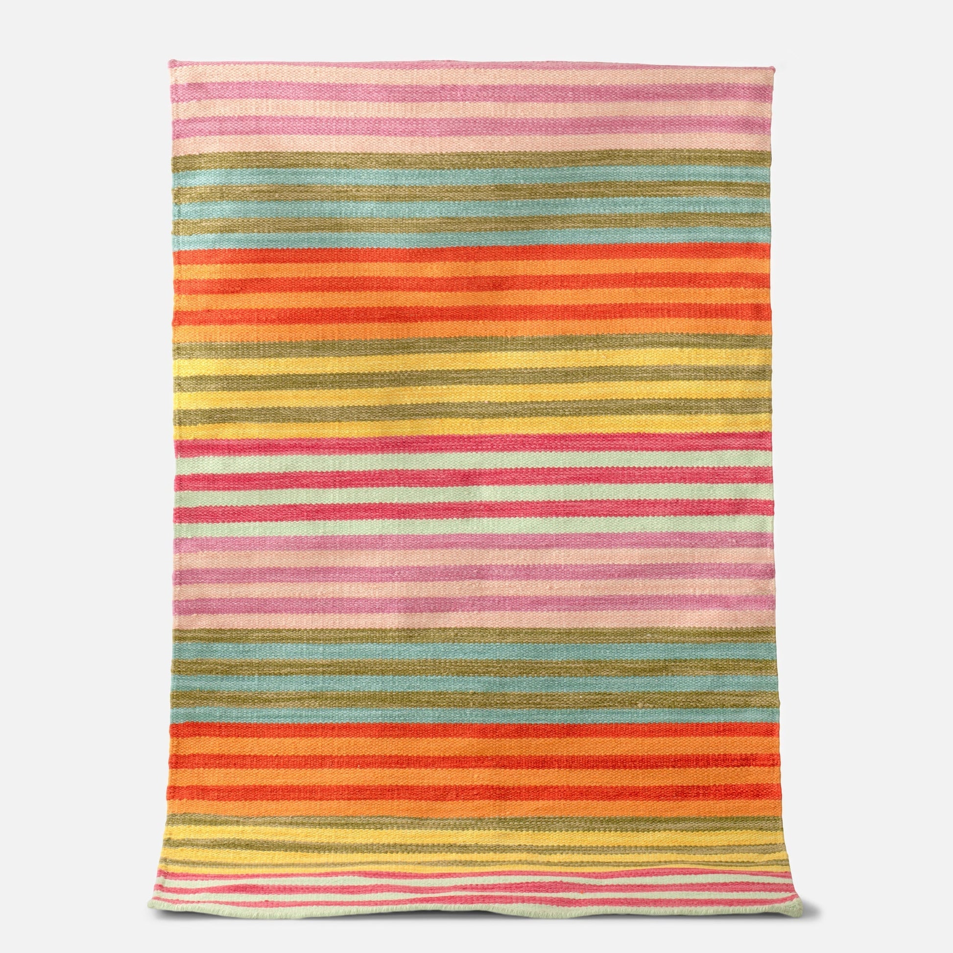 Full-length flat-lay of Lisse Performance Rug showcasing bold multicolor horizontal stripes on a white background